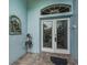 Front door entrance with decorative glass and accents at 9727 Oakwood Hills Ct, New Port Richey, FL 34655