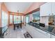 Kitchen features updated cabinets and granite countertops at 9727 Oakwood Hills Ct, New Port Richey, FL 34655