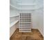Large walk-in closet with ample shelving at 9727 Oakwood Hills Ct, New Port Richey, FL 34655