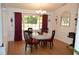 Bright dining room featuring a table with four chairs and large window at 377 Knights Bridge Rd, Spring Hill, FL 34609