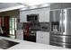 Modern kitchen featuring stainless steel appliances and white cabinetry at 377 Knights Bridge Rd, Spring Hill, FL 34609