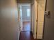 Hallway view with wood flooring leading to bedroom with natural light at 5265 E Bay Dr # 420, Clearwater, FL 33764