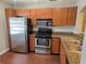 Galley kitchen featuring stainless steel appliances and granite countertops at 5265 E Bay Dr # 420, Clearwater, FL 33764
