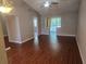 Open living room with vaulted ceilings and sliders to outdoor patio at 5265 E Bay Dr # 420, Clearwater, FL 33764