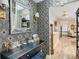Elegant powder room with gold accents and patterned wallpaper at 11836 Carissa Ln # B, New Port Richey, FL 34654