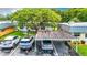 Aerial view showing condo, carport, and surrounding landscape at 11836 Carissa Ln # B, New Port Richey, FL 34654