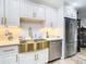Kitchen features a gold farmhouse sink and stainless steel appliances at 11836 Carissa Ln # B, New Port Richey, FL 34654