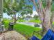 Relaxing patio overlooking a pond with fountain, grill, and comfortable seating at 11836 Carissa Ln # B, New Port Richey, FL 34654