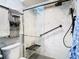 Large walk-in shower with marble tile and glass door at 11836 Carissa Ln # B, New Port Richey, FL 34654