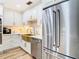 Modern kitchen features a gold farmhouse sink and stainless steel appliances at 11836 Carissa Ln # B, New Port Richey, FL 34654