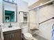 Clean bathroom with marble shower and modern vanity at 11836 Carissa Ln # B, New Port Richey, FL 34654