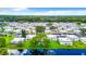 Aerial perspective of a large community by a lake at 11836 Carissa Ln # B, New Port Richey, FL 34654