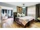 Bright main bedroom with king bed and access to sunroom at 11836 Carissa Ln # B, New Port Richey, FL 34654