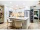 Modern kitchen features white cabinets, a large island, and stainless steel appliances at 11836 Carissa Ln # B, New Port Richey, FL 34654