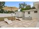 Backyard with lounge chairs, shed, and stock tank pool at 1108 66Th Nw St, Bradenton, FL 34209
