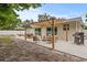 Outdoor patio with pergola, seating, and dining areas at 1108 66Th Nw St, Bradenton, FL 34209