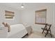 Bedroom with double bed, ceiling fan, and light, airy decor at 1108 66Th Nw St, Bradenton, FL 34209