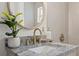 Bathroom vanity with granite countertop and gold fixtures at 1108 66Th Nw St, Bradenton, FL 34209