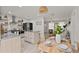 Modern kitchen with island, stainless steel appliances, and dining area at 1108 66Th Nw St, Bradenton, FL 34209