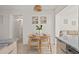 Bright dining area with a wooden table and four chairs at 1108 66Th Nw St, Bradenton, FL 34209