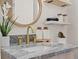 Elegant bathroom vanity with granite countertop and gold fixtures at 1108 66Th Nw St, Bradenton, FL 34209