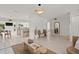 Open concept living room with kitchen view, light and bright at 1108 66Th Nw St, Bradenton, FL 34209