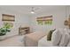 Spacious bedroom with a bed, desk, and plenty of natural light at 1108 66Th Nw St, Bradenton, FL 34209