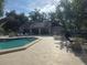 Community pool with lounge chairs and cabana at 5265 E Bay Dr # 420, Clearwater, FL 33764
