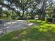 Landscaped grounds with mature trees and grass at 5265 E Bay Dr # 420, Clearwater, FL 33764