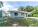 Front yard view of a single-story house with a spacious lawn at 1007 14Th Nw Ave, Largo, FL 33770