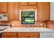 Kitchen sink with double basin and window overlooking the backyard at 9108 Bassett Ln # B, New Port Richey, FL 34655