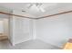 Bedroom with large closet and ceiling fan at 9108 Bassett Ln # B, New Port Richey, FL 34655