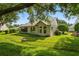 Charming house exterior with green lawn at 9108 Bassett Ln # B, New Port Richey, FL 34655