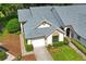 Aerial view of a tan villa with gray roof and landscaping at 9108 Bassett Ln # B, New Port Richey, FL 34655