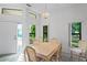 Dining room with light wood table and chairs at 9108 Bassett Ln # B, New Port Richey, FL 34655