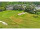 Aerial view of a golf course with homes and lush landscaping at 9108 Bassett Ln # B, New Port Richey, FL 34655