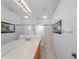 Bathroom with double vanity, shower and view of bedroom at 9108 Bassett Ln # B, New Port Richey, FL 34655