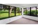 Sunroom with ample natural light and backyard view at 9108 Bassett Ln # B, New Port Richey, FL 34655