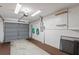 Attached garage with storage and pegboard walls at 9108 Bassett Ln # B, New Port Richey, FL 34655