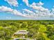 Aerial view of community clubhouse and green space at 7428 Heather Walk Dr, Weeki Wachee, FL 34613