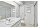 Clean bathroom with a single vanity, toilet, and shower at 1096 Florian Way, Spring Hill, FL 34609