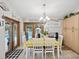Kitchen features a dining area, lots of cabinets, and a view of the pool at 1096 Florian Way, Spring Hill, FL 34609