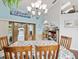 Bright dining room with hardwood floors and view of the pool at 1096 Florian Way, Spring Hill, FL 34609