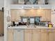 Kitchen with a breakfast bar, stainless steel dishwasher, and microwave at 1096 Florian Way, Spring Hill, FL 34609