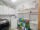 Bright laundry room with washer, dryer, and ample storage at 1096 Florian Way, Spring Hill, FL 34609