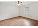 Simple bedroom with light wood flooring and a window at 1096 Florian Way, Spring Hill, FL 34609
