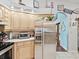 Kitchen boasts stainless steel appliances and light wood cabinets at 1096 Florian Way, Spring Hill, FL 34609