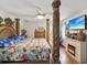 Spacious main bedroom with a king-size bed and fireplace at 1096 Florian Way, Spring Hill, FL 34609
