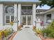 Welcoming front entrance with double doors and lush landscaping at 1096 Florian Way, Spring Hill, FL 34609