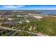 Aerial view of townhomes near water and green space at 2222 Andover Cir, Palm Harbor, FL 34683